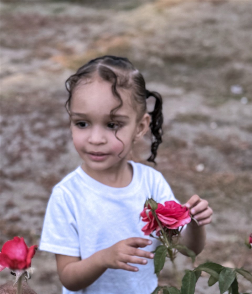 Ruby holding pink flowers
